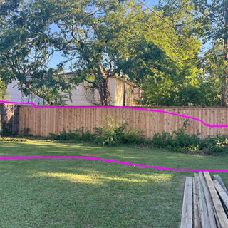 Backyard fence line with drawn outline of a planting bed – Good Deal Builder, Dallas TX