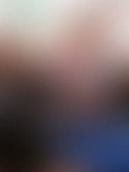 Reese Witherspoon reading a book on sofa