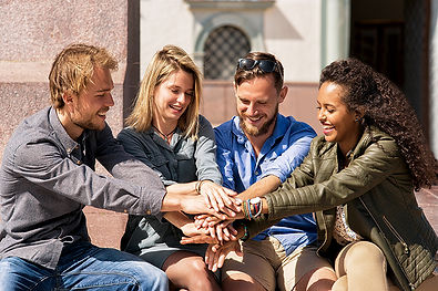 group-cheerful-friends-holding-hands-togetherness-concept