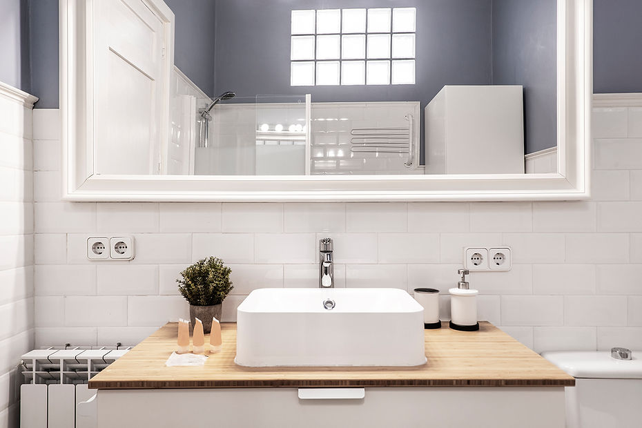 front-view-cloakroom-with-square-porcelain-sink-wood-countertop-white-framed-mirror-white-