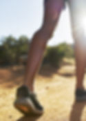 Person walking on dirt trail