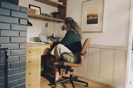 Person with ADHD struggling with inconsistent eating habits at desk