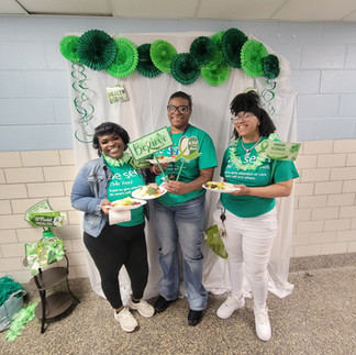 Coleman Health Services staff participating in the Be Seen with Green campaign for Mental Health Awareness Month.