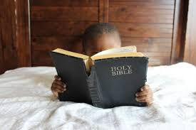 child reading the Bible
