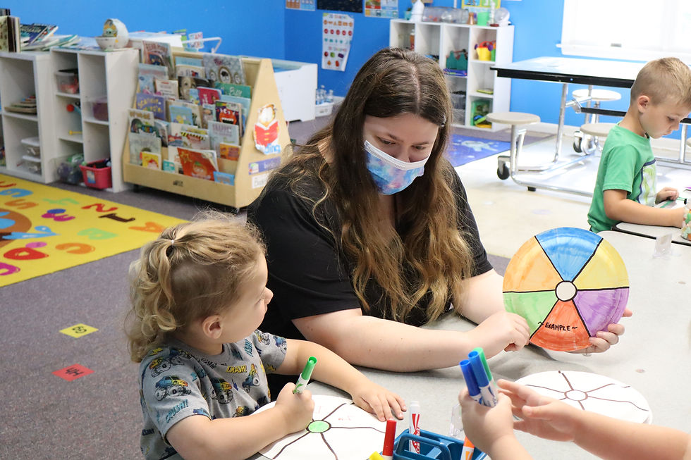 Instructor and kid doing crafts.JPG