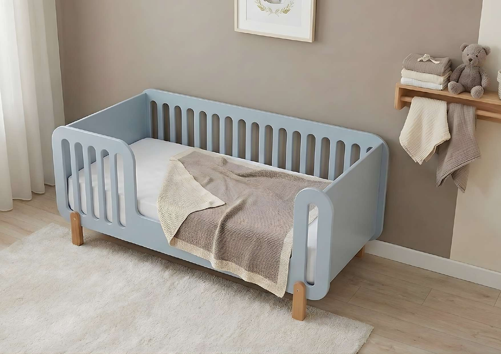 Blue toddler bed with blanket and small shelf with teddy bear.