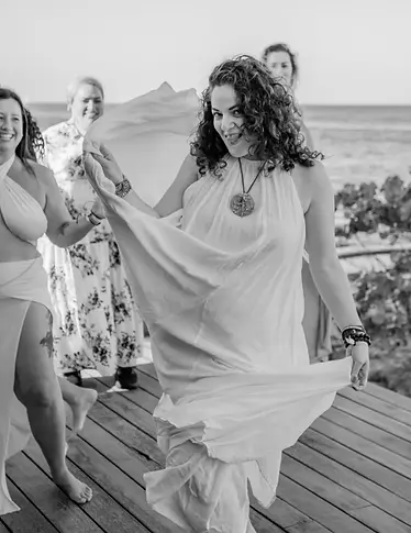 Rachel Plonka leading a group movement session by the sea at The Coherence Studio.
