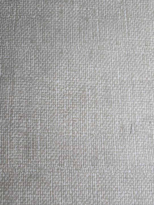 Woven Texture print fabric adds subtle depth and a touch of warmth to any quilting or sewing project.