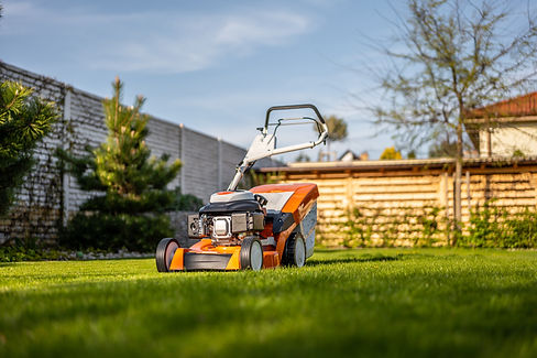 Lawn mover on green grass in modern garden Machine for cutting lawns.jpg