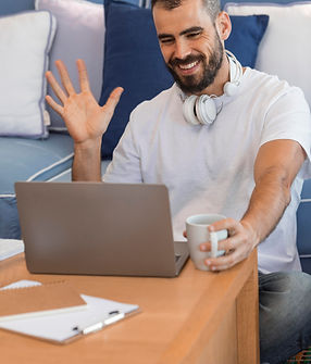 medium-shot-man-waving-laptop.jpg