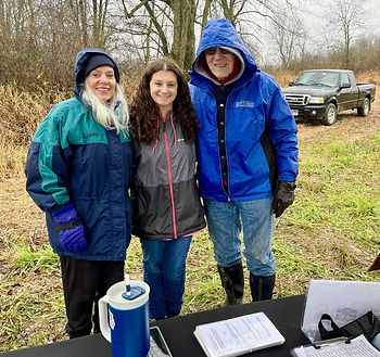 YSU Legacy Forests Committee Members Catherine Cala, Christina Corturillo, and Lauren Schroeder pose at the registration table.
