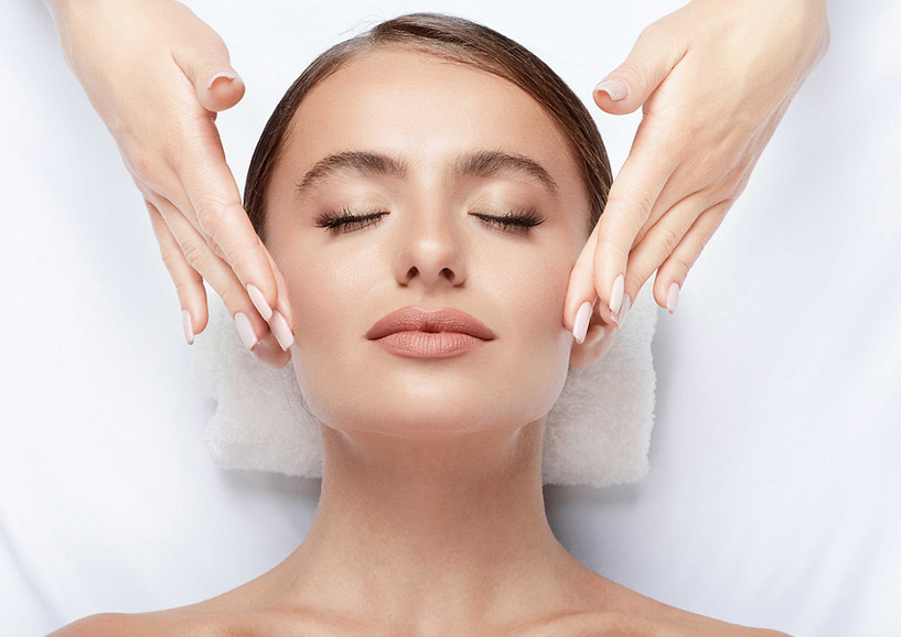 Image of a woman enjoying a facial treatment, symbolizing the rejuvenating experience of chemical peels at Enhanced Beauty Aesthetics in Norwich.