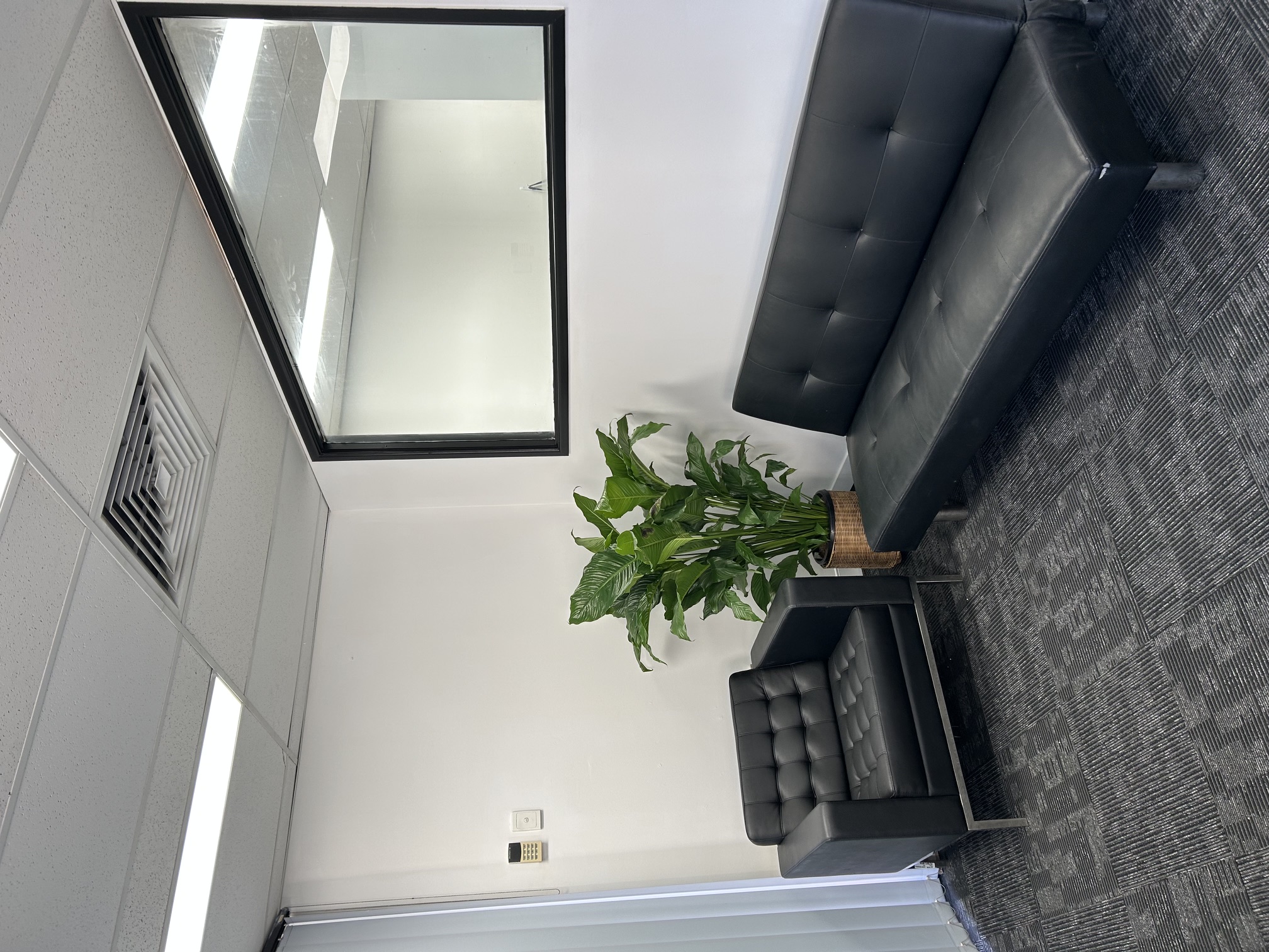 Foyer area with open floor space and seating