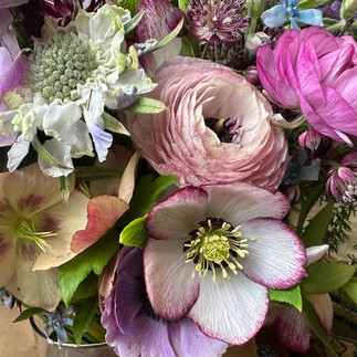 Spring bridal bouquet with hellebore and ranunculus