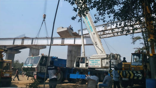 Heavy steel girder launching operation in Bharuch using hydraulic mobile crane for bridge construction project