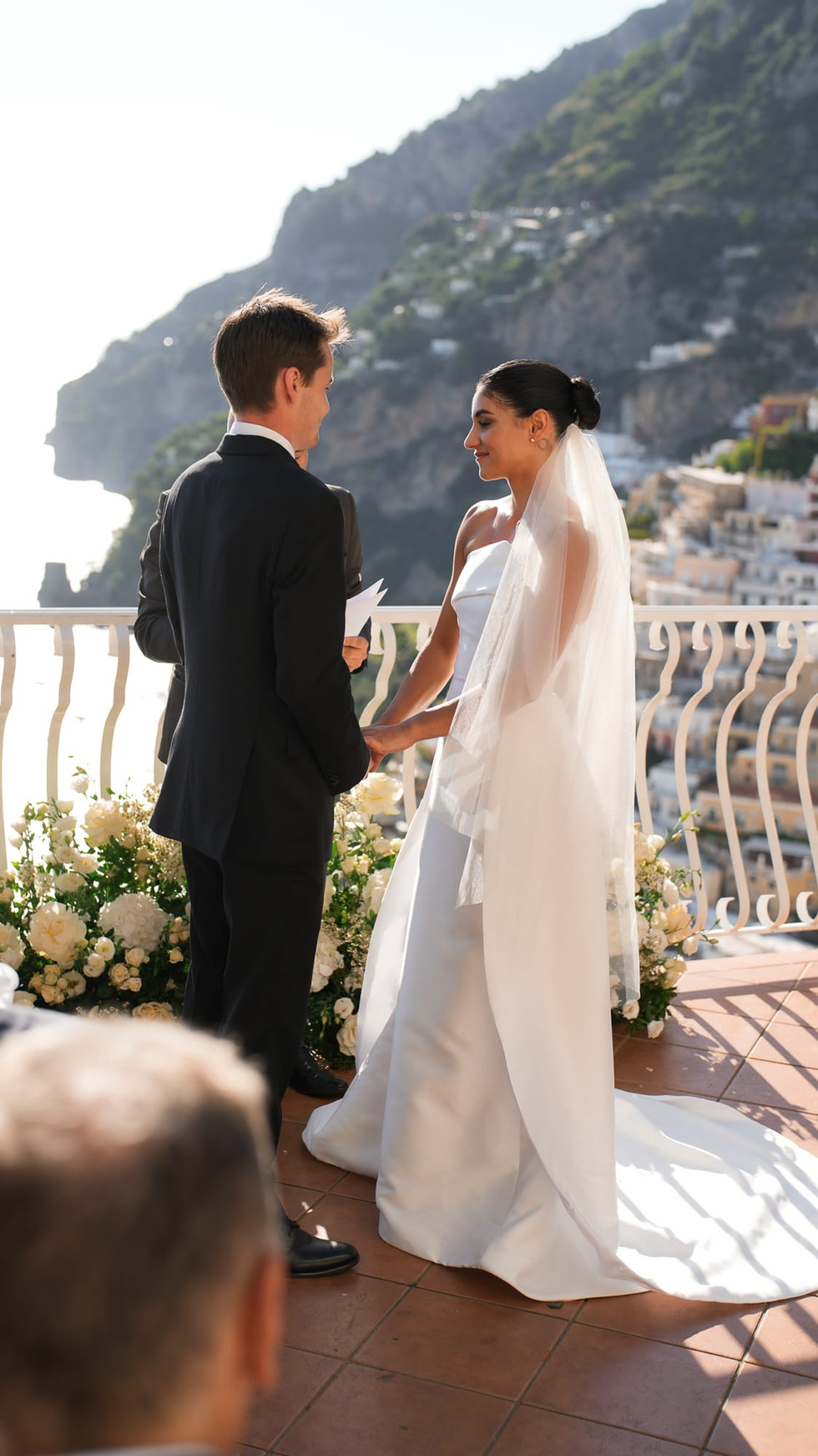 Couple exchanging vows, Destination Wedding Positano • Ian and Arianna, overlooking the Amalfi Coast. destination wedding positano