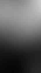 Bride walking through medieval arches of Villa Cimbrone, soft golden light.