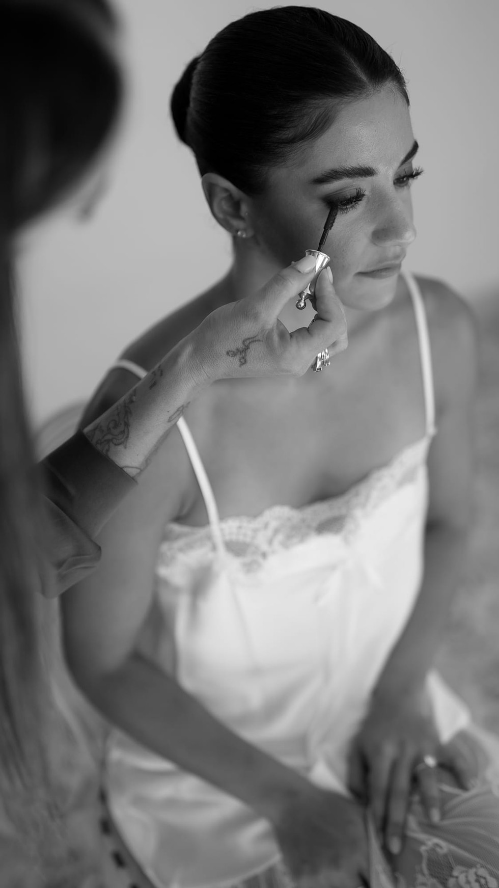 Makeup artist applying mascara to bride Destination Wedding Positano • Ian and Arianna