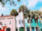 Palm trees in front of colorful buildings, just one sight you may come across on a summer roadtrip