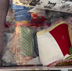 large inherited fabric stash spread out for organizing