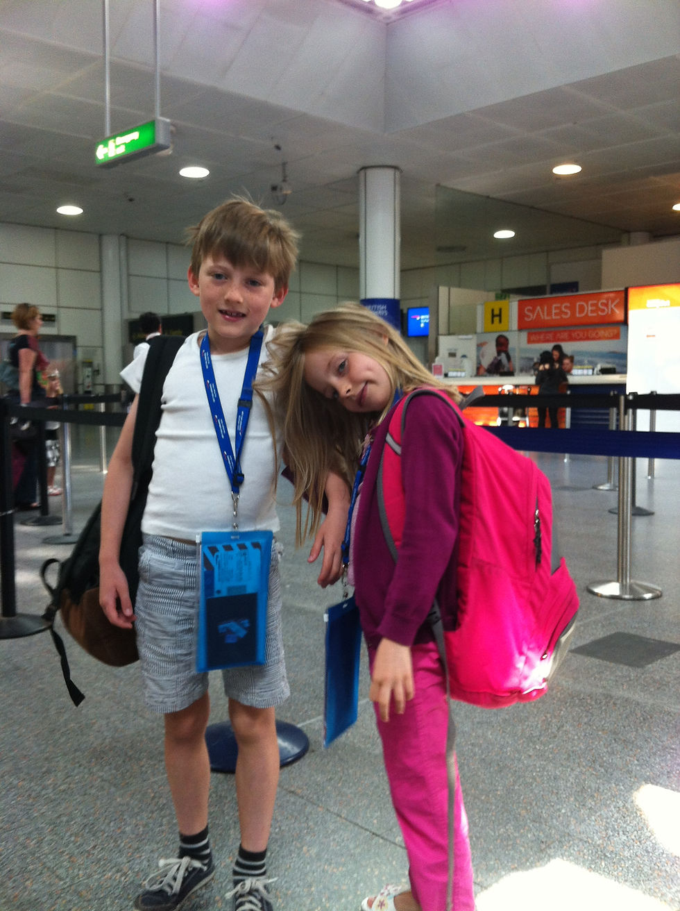 Young children prepare for a flight.
