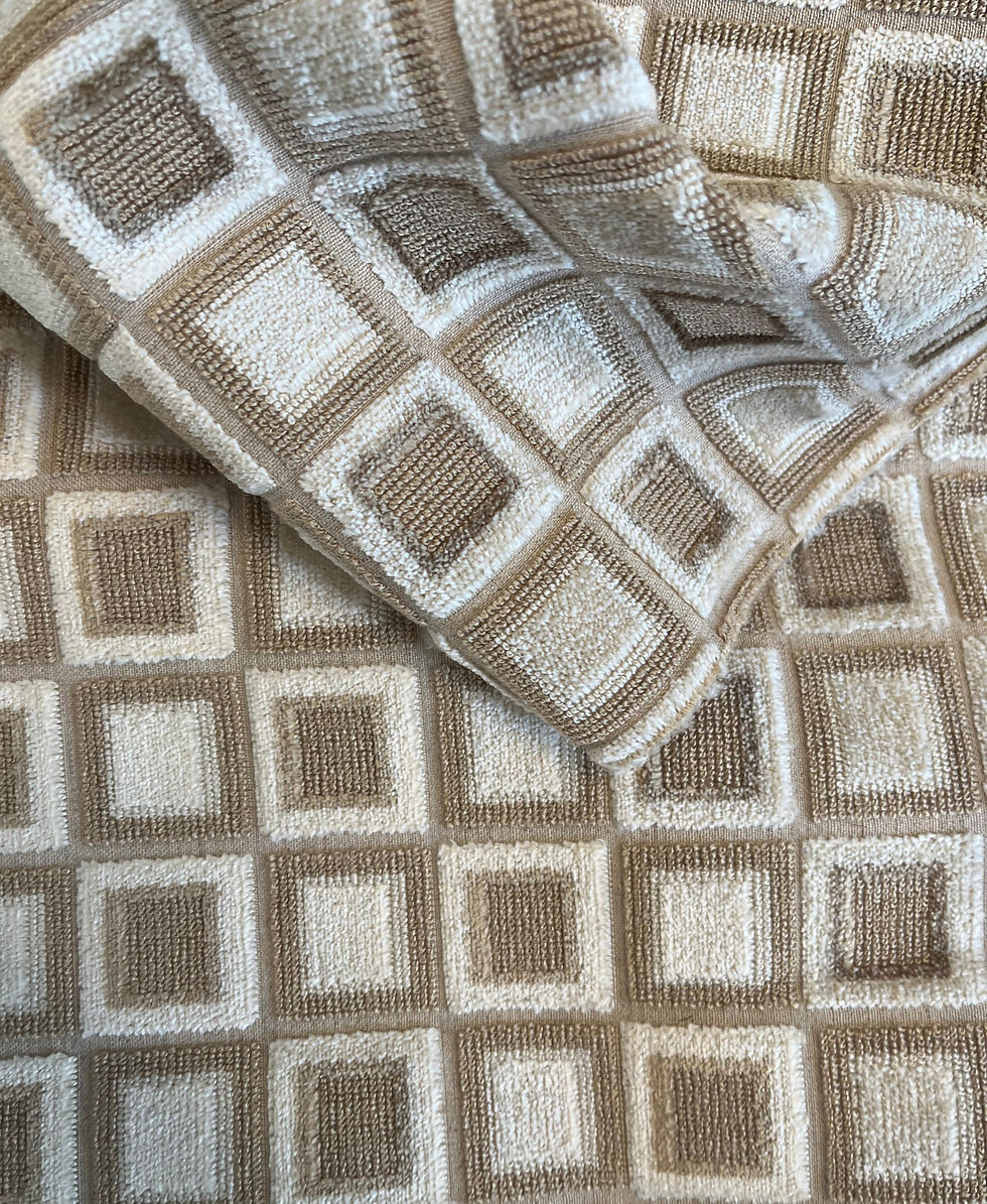 A beige and taupe fabric with a textured square design