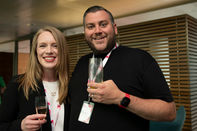 A man and a woman pose for a photo at the Best Workplaces in Travel Awards 2024