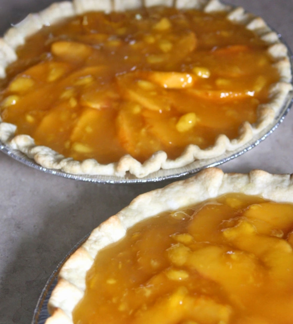two homemade peach pies