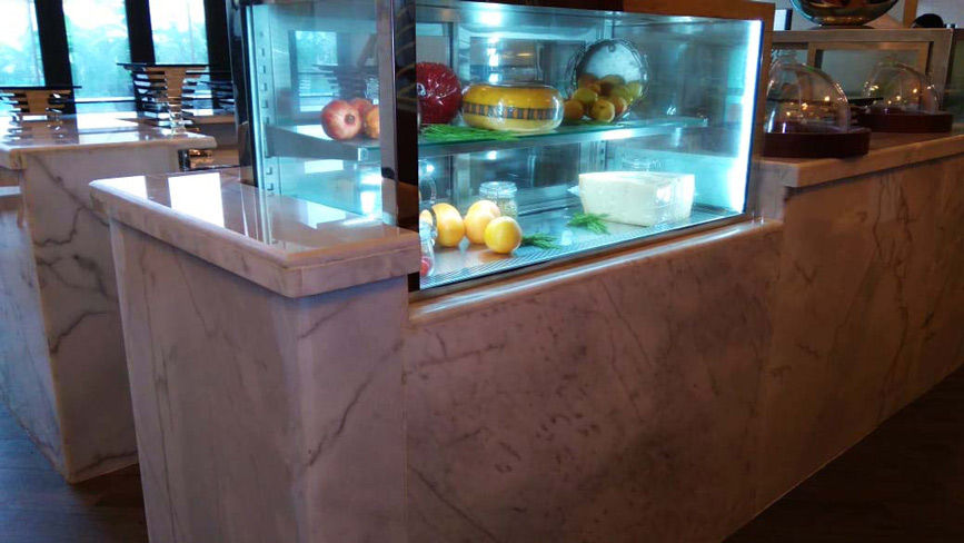 Restaurant counters made of marine plywood and wooden structure, cladded with Statuario Italian marb