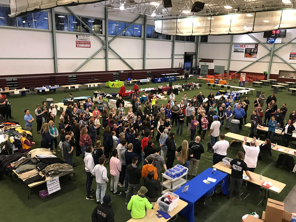 Wide angle view of a community gathering at the Project Homeless Connect event
