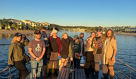 Young people on boat at sunset