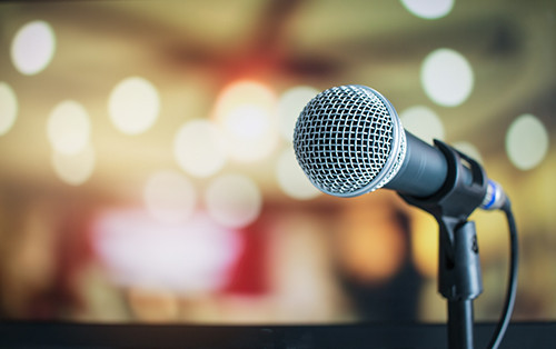 a microphone stands ready in a conference room