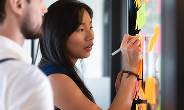 Focused asian business woman mentor coac