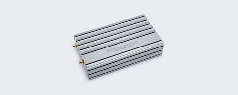 Compact Crescendo Revolution 5A1 amplifier, offering consistent power across all speaker impedances with high-resolution Class AB design.