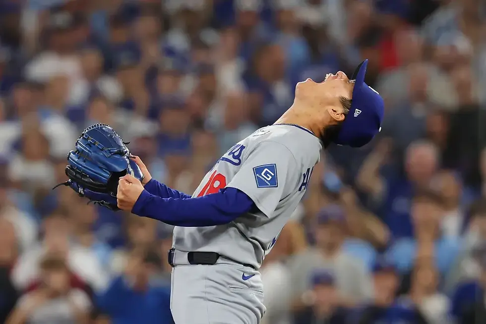 Dodgers' pitcher Yoshinobu Yamamoto reacts on the mound as the team seals its World Series win in Game 7. Getty Images