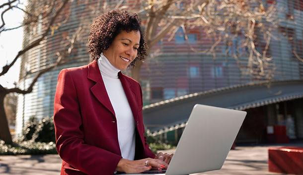 portrait-senior-woman-professional-blazer-outdoors-laptop.jpg