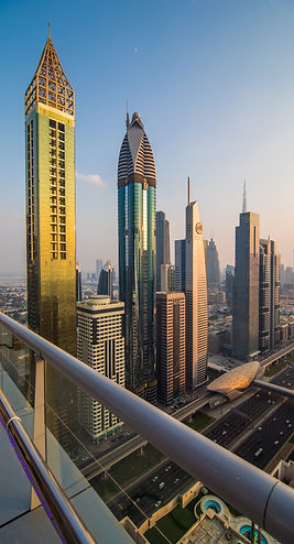 Modern glass skyscrapers reflecting sky in a business district cityscape