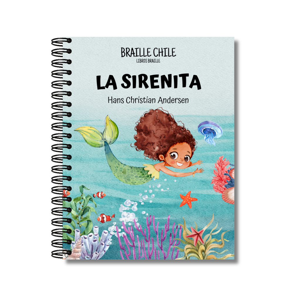 Libro en braille anillado "La sirenita" de Hans Christian Andersen; portada con una sirena de pelo crespo y cola verde nadando en el mar entre corales y peces. (foto 1 de 2)
