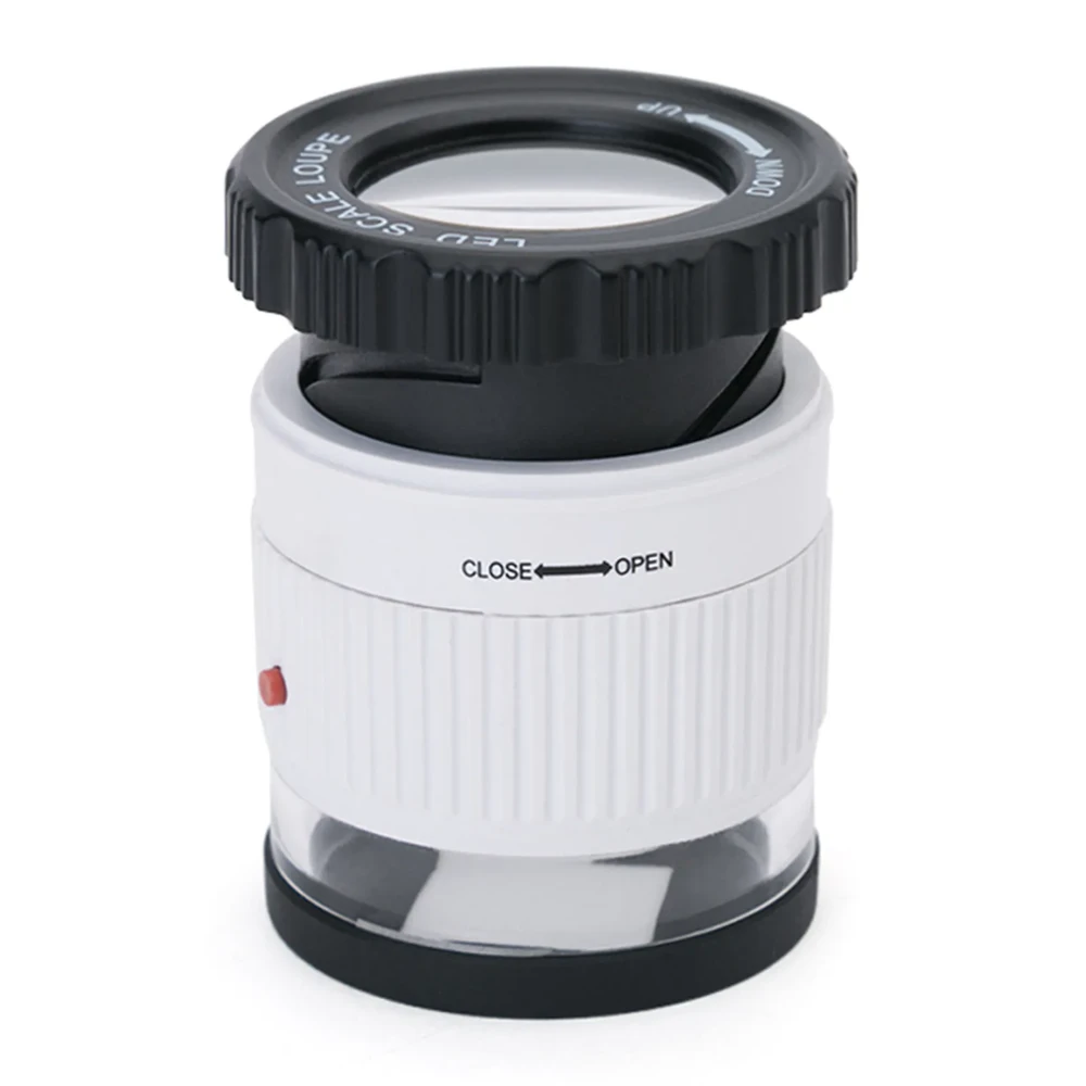 Lupa de escala 30x con luz LED, de forma cilíndrica: aro de enfoque negro arriba con el texto «LED Scale Loupe», cuerpo blanco con la indicación «Close-Open», un botón rojo y base transparente. (foto 1 de 3)