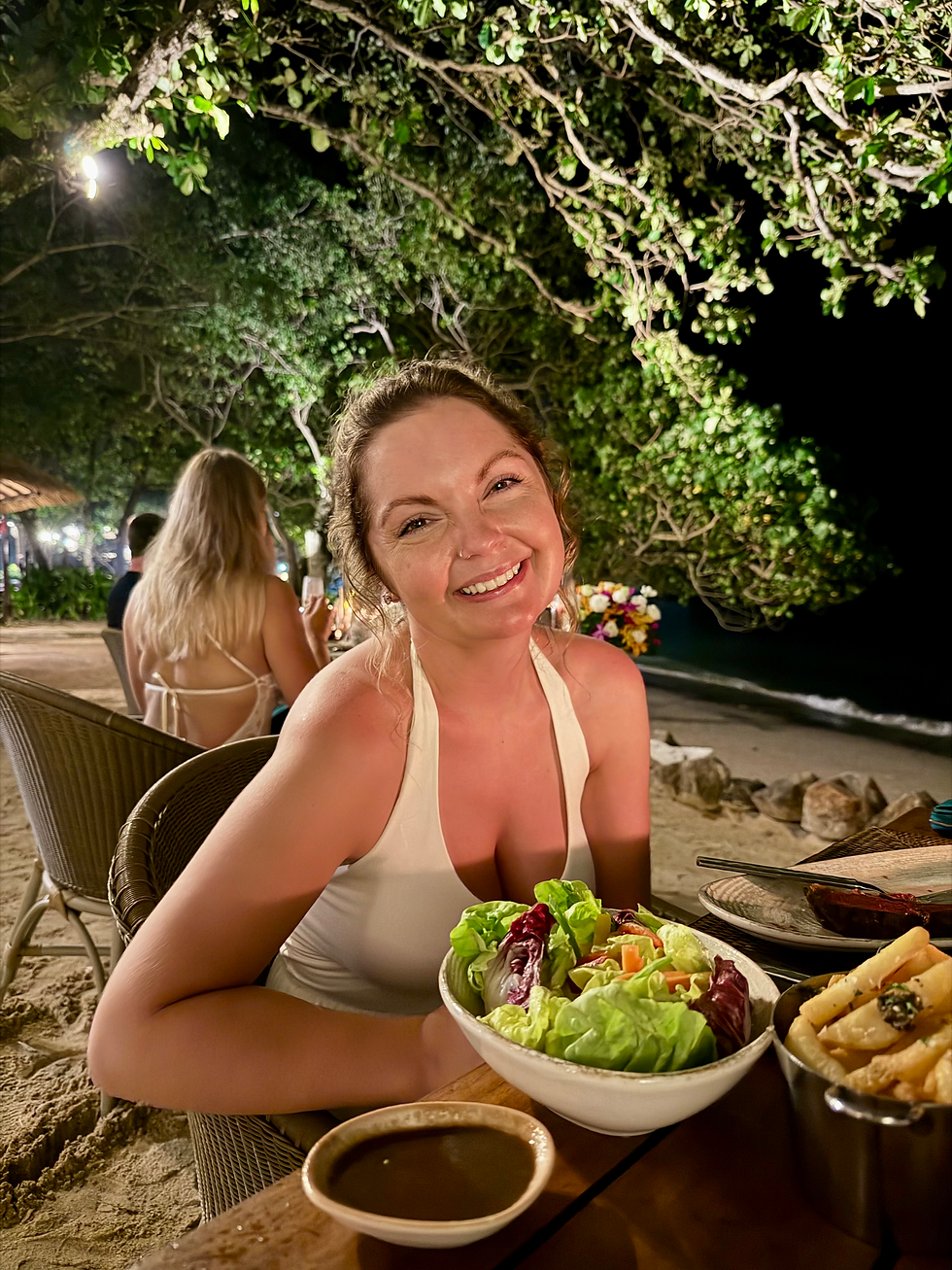 woman having dinner at night at the grotto krabi thailand