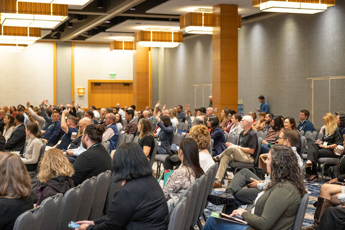 Photo of a full room asking questions