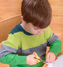 Small Cute Boy Cutting with Scissors_edi