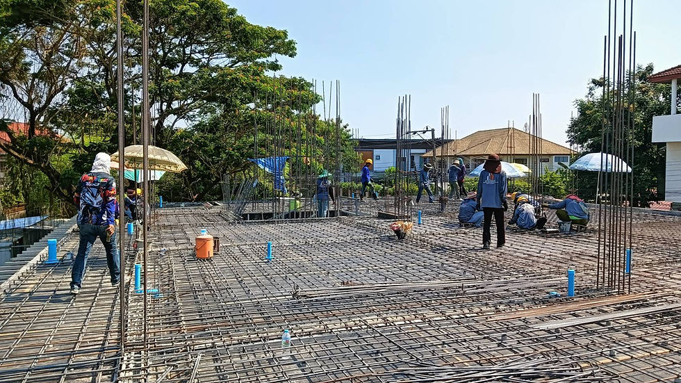 Eye-level view of a construction site with cranes and building structures