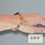 Thumbnail: simple olive wood beaded bracelet with a Christian cross charm for christian gift from the HOly Land