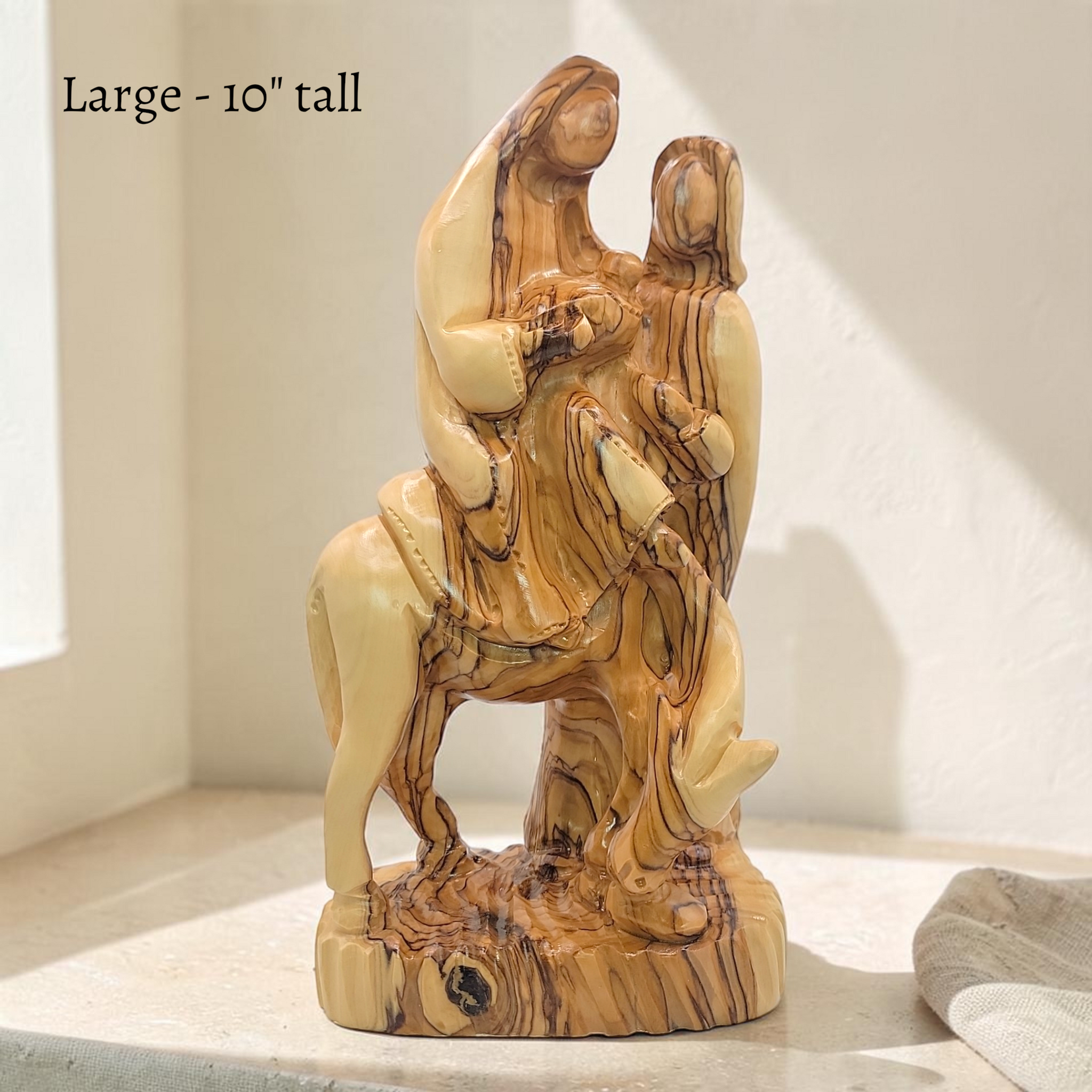 Front view of the large olive wood Flight to Egypt statue with Mary, Jesus, Joseph and donkey