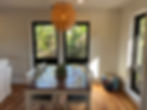 Thoughtfully placed windows overlook the greenery of seagrape trees and native palms.