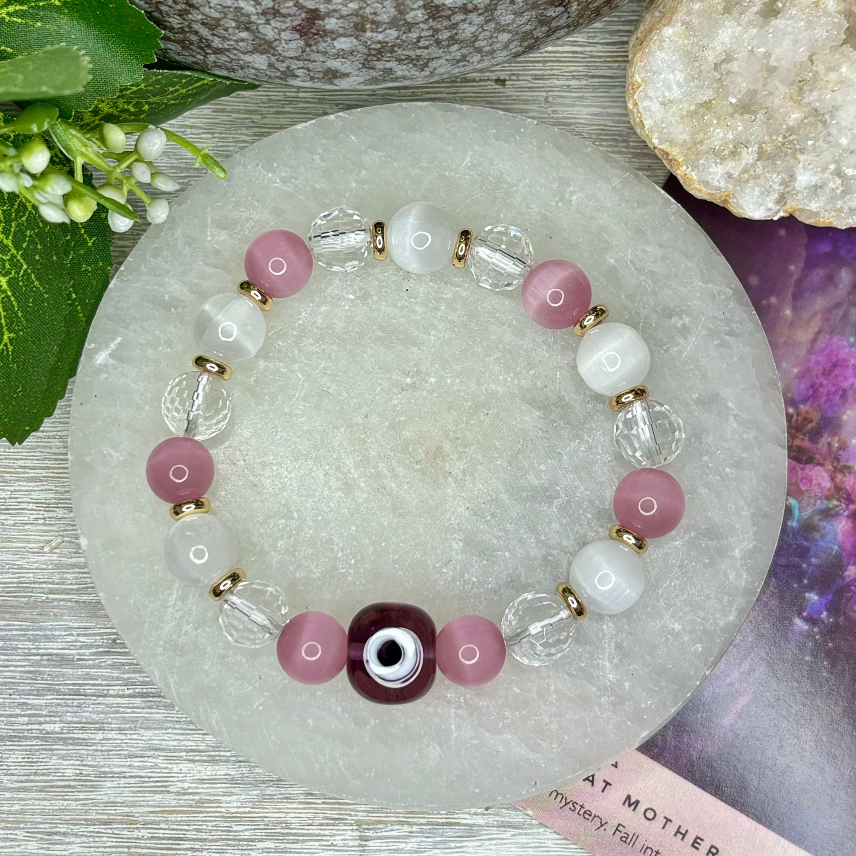 EVIL EYE PURPLE- SELENITE, PINK CATS EYE & CLEAR QUARTZ FACETED - GOLD
