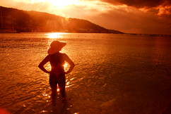 Sunset Photo of a model in a hat in the Caribbean SEa.