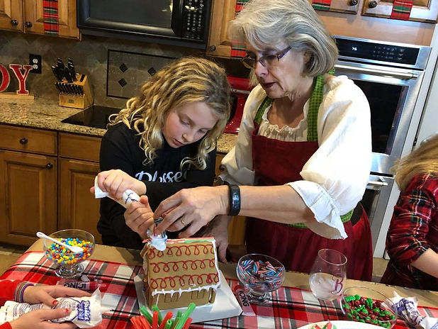 Mrs Claus helps with gingerbread house.jpg