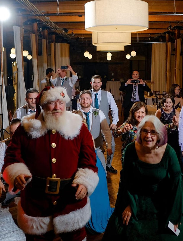 Santa and Mrs Claus dancing at wedding reception_edited_edited.jpg
